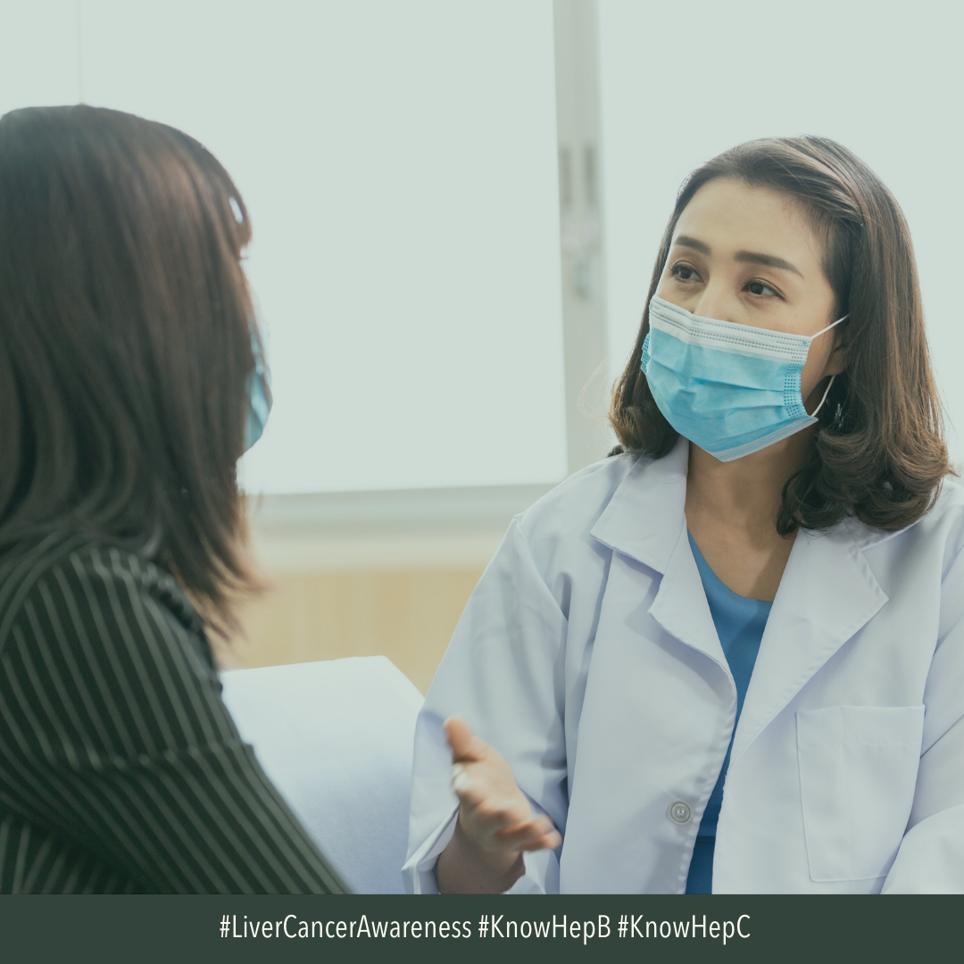 Image of Asian American female doctor wearing a mask. She is talking to a patient. 